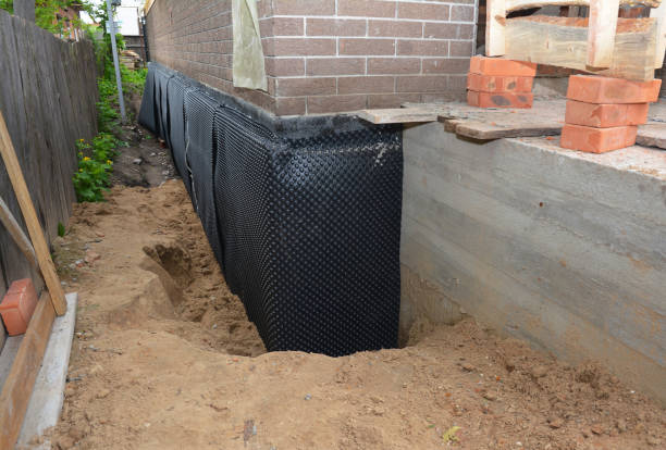 Happy homeowners after waterproofing job in Pleasant Ridge